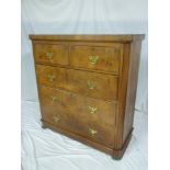 A late Victorian figured walnut chest of two short and three long drawers with brass ring handles