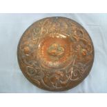 A Newlyn copper circular plaque, believed by John Pearson,
