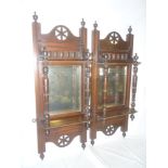 A pair of Victorian walnut rectangular wall shelves with central bevelled mirror panels and turned