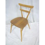 A 1960's Ercol light elm occasional chair with bar back and shaped seat on tapered legs