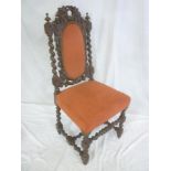 A 19th Century carved oak occasional chair with upholstered seat and back pad on spiral turned