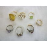 A 9ct gold dress ring set opals and garnets, three other various 9ct dress rings,