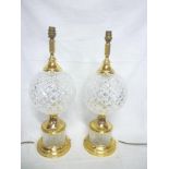 A pair of Waterford cut Crystal and brass mounted table lamps with fabric shades