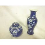 A 19th Century Chinese baluster-shaped vase with blossoming branch decoration on blue ground and