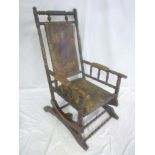 An old American rocking chair with leather upholstered seat,