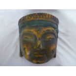 An old Eastern lacquered papier mache ceremonial mask with painted decoration