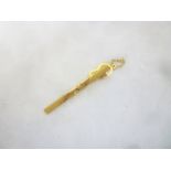 An Italian 9ct gold tie clip set a sapphire