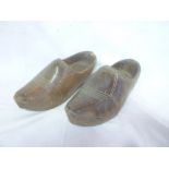 A pair of old wooden clog shoes