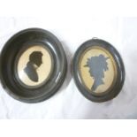 An early 19th Century silhouette miniature portrait reversed on glass depicting bust portrait of J