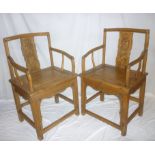 A pair of old Chinese carved and polished wood carver armchairs with figure decorated splat backs