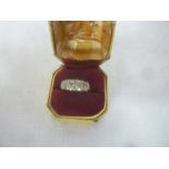 An 18ct gold engagement ring set eleven diamonds