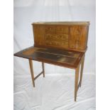 A late Victorian inlaid mahogany ladies writing table with folding leather inset writing surface,