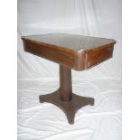 A 19th Century rosewood rectangular centre table with a drawer in each end on facetted column with