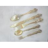 A Victorian silver spoon and fork with raised scroll decoration, Sheffield marks,