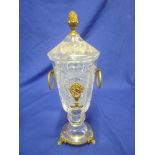 A good quality cut glass and gilt mounted two handled pedestal vase and cover with raised floral
