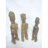 Three old African carved wood tribal figures,