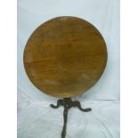 A 19th Century mahogany circular turnover-top occasional table with bird cage movement on turned