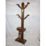 A Victorian mahogany hall tree/stand with central slim mirror and compartment enclosed by a hinged