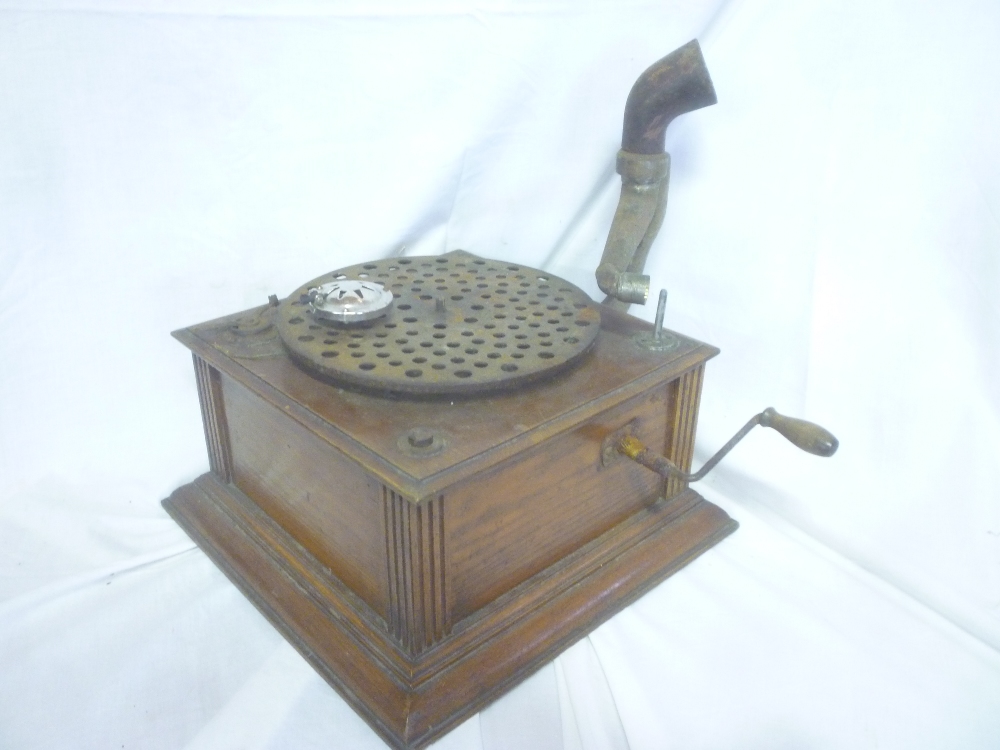 An old oak cased table top gramophone with provision for a horn