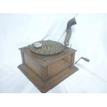 An old oak cased table top gramophone with provision for a horn
