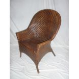 An old Colonial style cane work easy chair