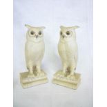 A pair of American Bochm pottery figures of owls perched on books,