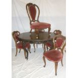 A 19th Century French rosewood and mahogany dining/parlour suite comprising a rosewood oval dining