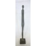 An unusual Etruscan-style bronze elongated figure of a male "Ombra" 14½" high