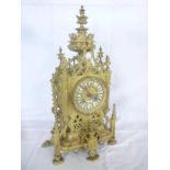 An ornate French brass Cathedral style mantel clock by Feliot of Rennes,