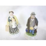 A pair of Continental china match holders with strikers in the form of a lady and gentleman "I am
