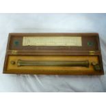 A brass and boxwood rolling rule by W H Harling Ltd London in fitted case