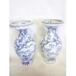 A pair of 19th Century Chinese baluster-shaped vases with blue and white bird and floral decoration,