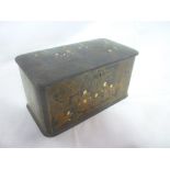 An old Eastern lacquered rectangular tea caddy decorated all over with numerous character figures