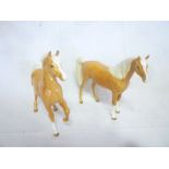 Two Beswick china figures of palomino ponies