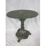 A Victorian Coalbrookedale-style circular garden table with pierced top,