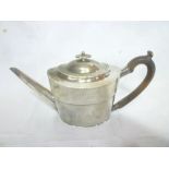 A George III silver oval teapot with engraved decoration,