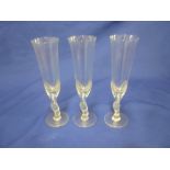 A set of twelve Faberge "Kissing Snow Dove" glass wine goblets with decorated stems