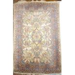 A good quality floral decorated wool rug: 70" x 48"