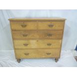 A 19th Century polished pine chest of two short and three long drawers with brass ring handles on