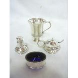 A George V silver tapered christening jug with decorated edge and scroll handle,