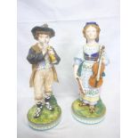 A pair of 19th Century china male and female musician figures, possibly Minton's,
