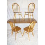 A 1960's Ercol light elm rectangular dining table 59" x 30" together with a set of Ercol light elm