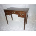 A George III mahogany rectangular side table with three drawers in the frieze on square legs