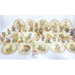A collection of Hummel china figurines and plates including approximately 30 various china figures