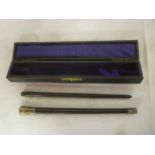 A George V silver mounted ebony two-piece conductors baton with engraved decoration,