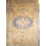 An old Eastern hand-knotted wool rug with triple panelled decoration on brown and grey ground 68" x