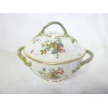 An early 19th Century Chelsea china oval two-handled jar and cover with painted fruit and floral