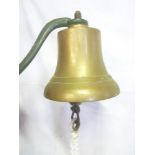 An old brass ship's-style bell with wall mounting bracket