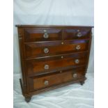 A 19th Century figured mahogany chest of two short and three long drawers with glass handles and