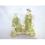 A Royal Dux china figure of a male musician and female on a balcony,